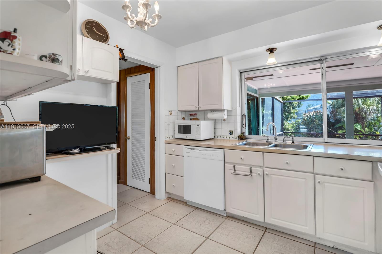 16001 Southwest 98th Avenue Miami, FL 33157 - Photo 7 of 22 a kitchen with a sink and cabinets