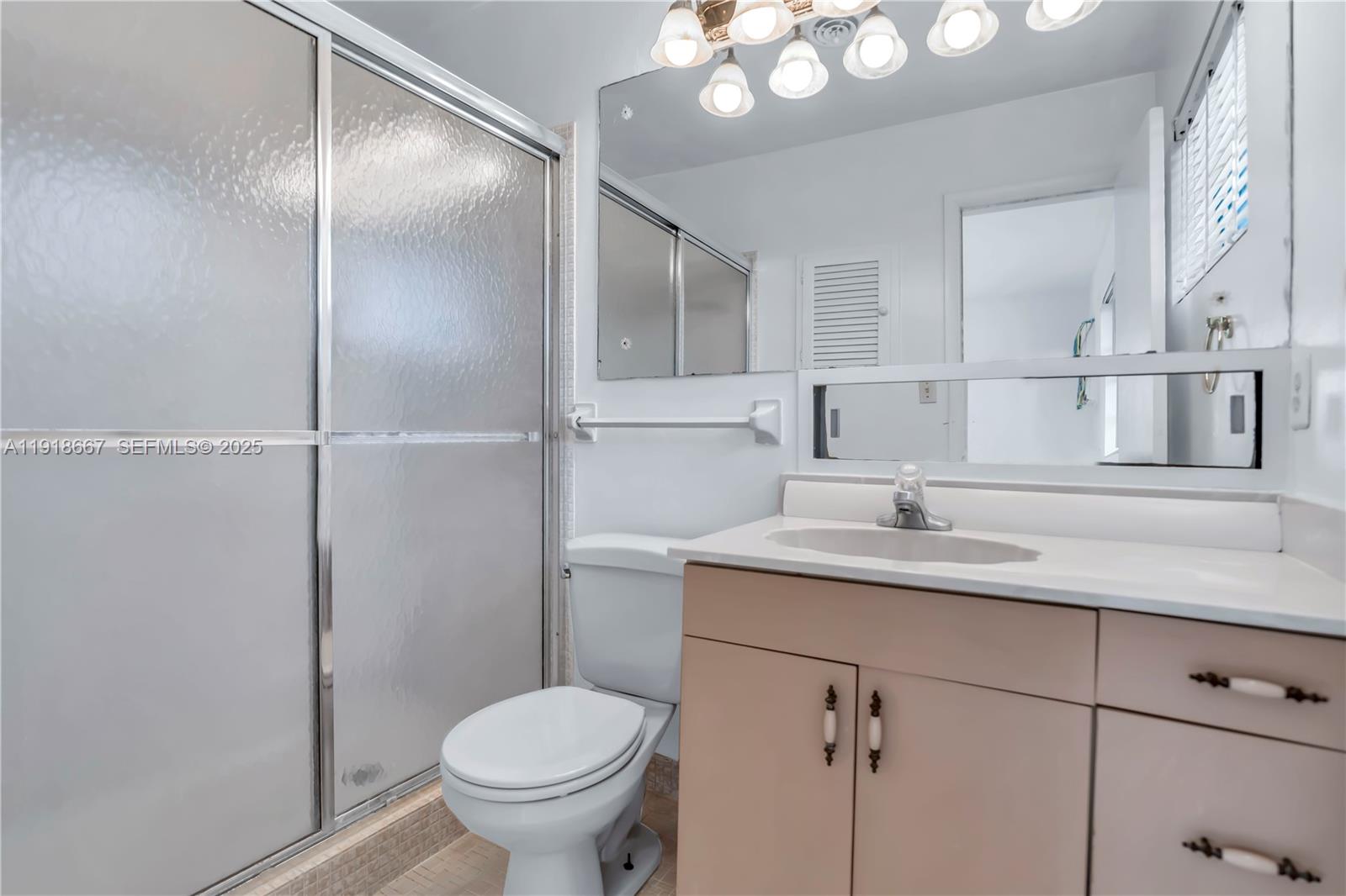 16001 Southwest 98th Avenue Miami, FL 33157 - Photo 10 of 22 a bathroom with a granite countertop sink a toilet and mirror
