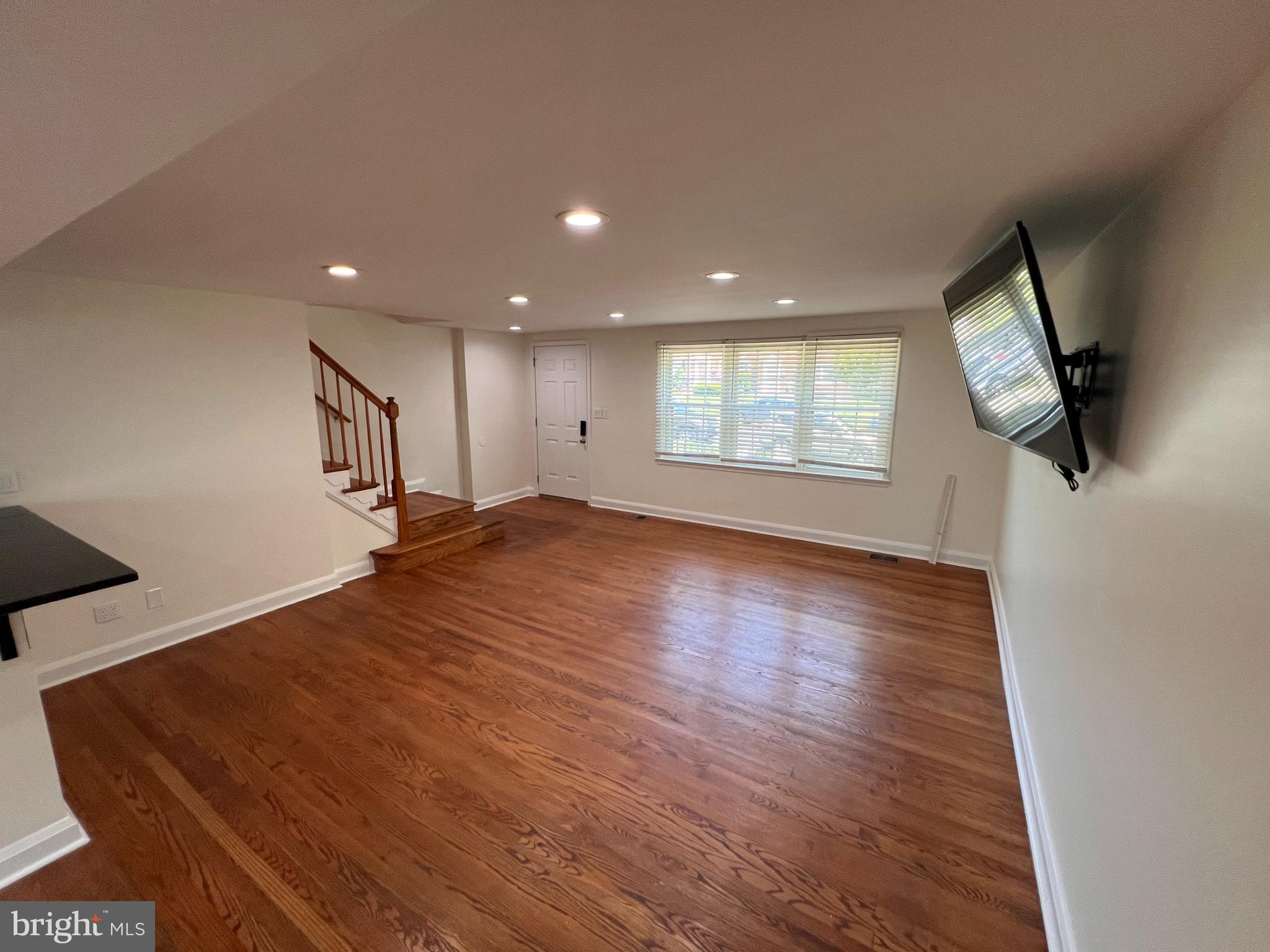 1583 Doxbury Road Towson, MD 21286 - Photo 2 of 31 an empty room with wooden floor and windows