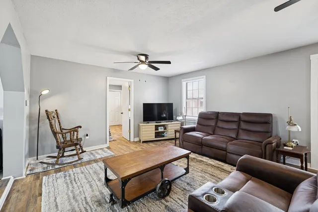a living room with furniture and a flat screen tv