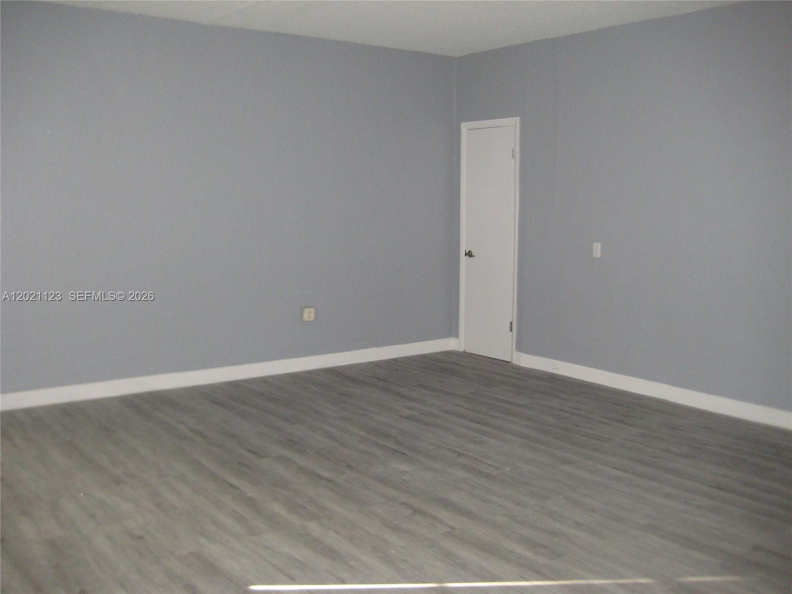 13220 Southwest 99th Place Miami, FL 33176 - Photo 7 of 16 wooden floor in an empty room
