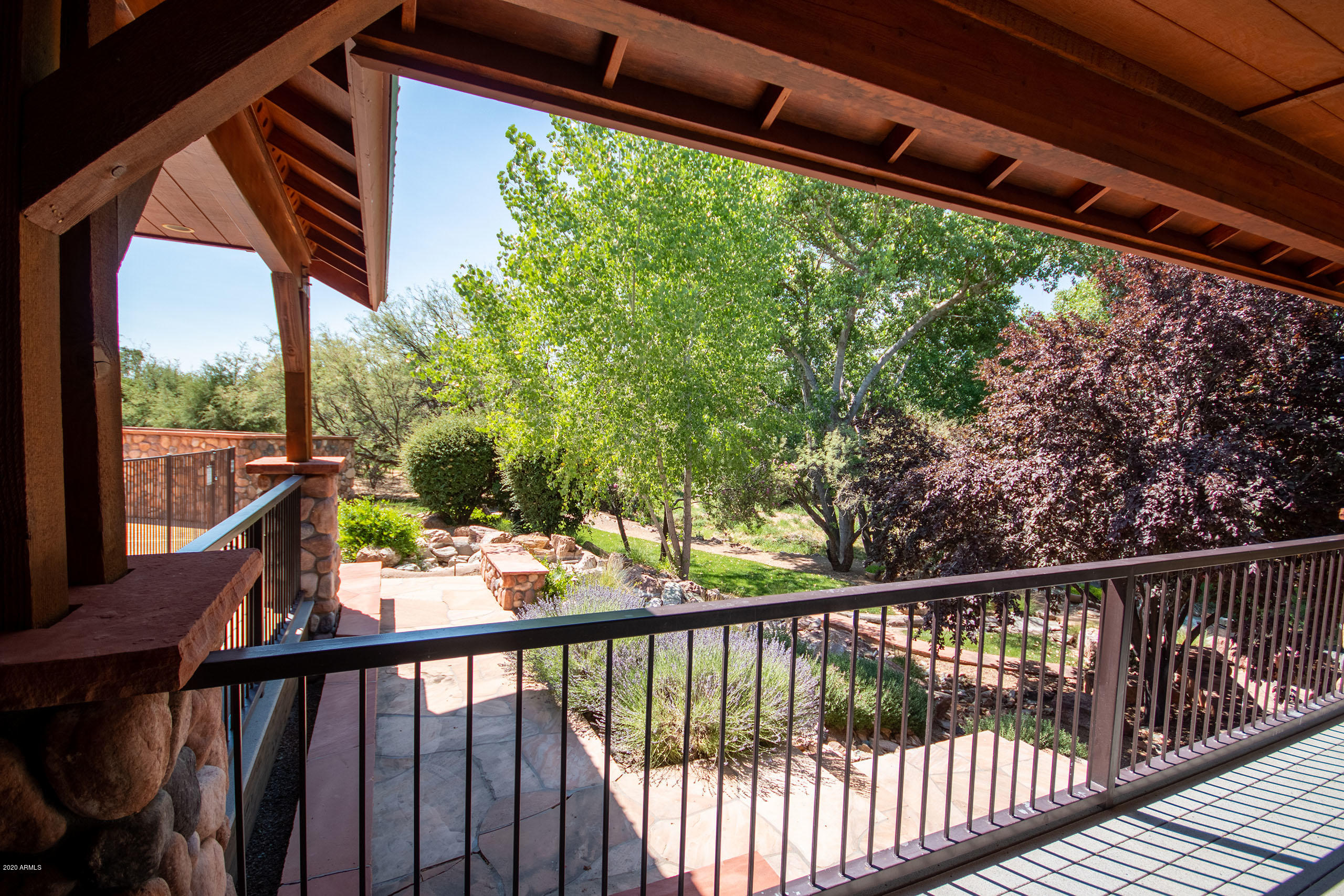 15415 East Countryside Road, Unit 303 Mayer, AZ 86333 - Photo 14 of 18 Clubhouse-Deck greenery