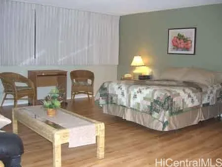 a bedroom with bed and window