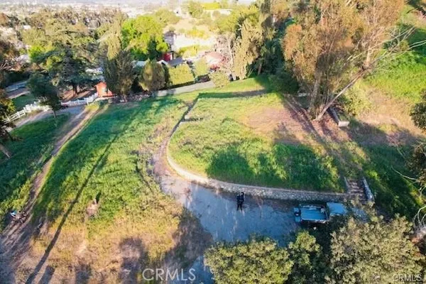 a view of a swimming pool with a yard
