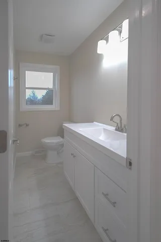 a bathroom with a bathtub and a sink