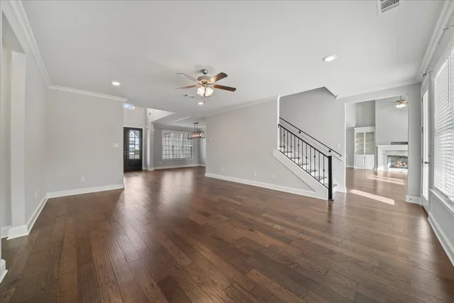 a view of an entryway with wooden floors