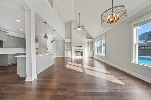a view of a living room and chandelier
