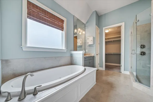 a bathroom with a tub and shower