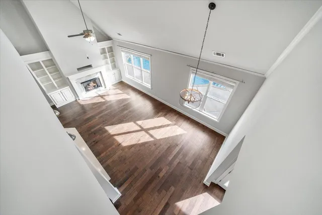 a view of an entryway with wooden floor