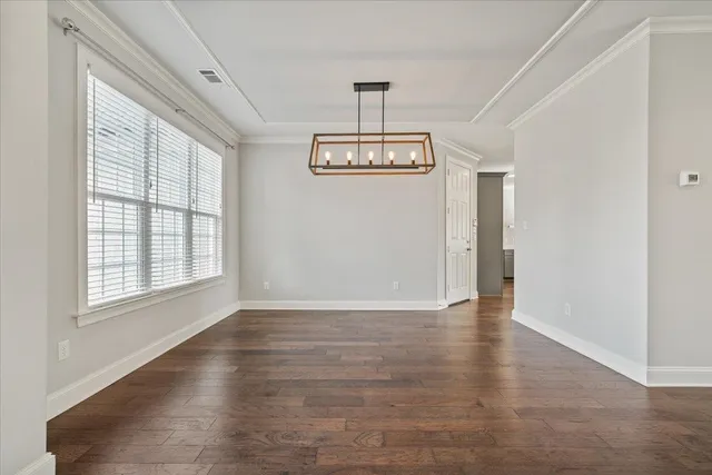 a view of an entryway with wooden floor
