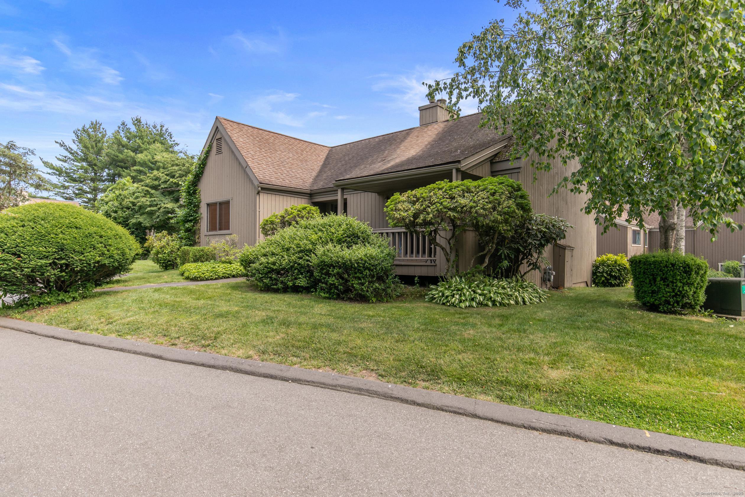 a view of a house with garden and plants