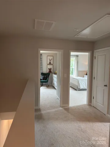 a view of a livingroom with a couch and dresser