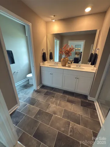 a bathroom with a sink and mirror