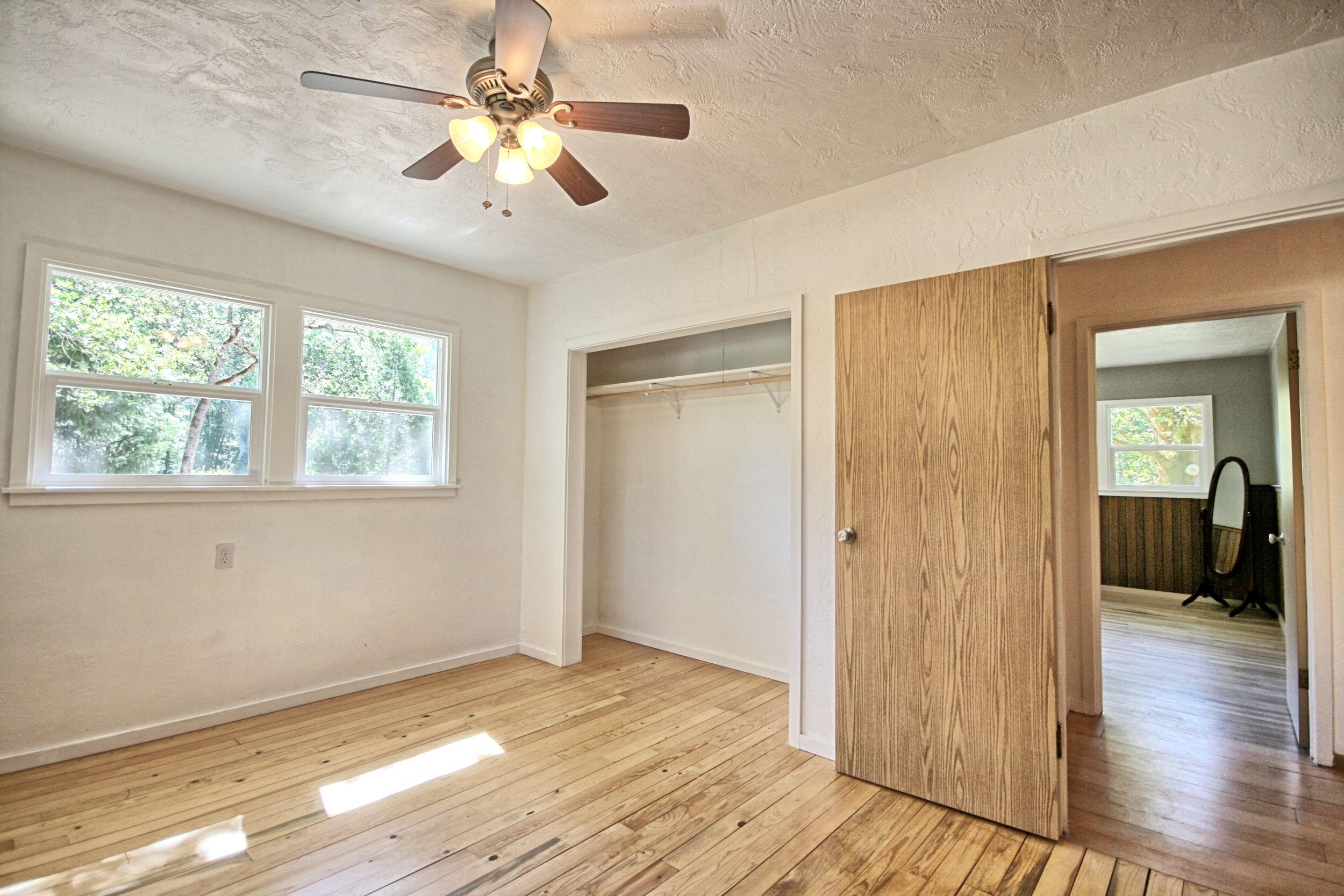 199 Powell Creek Road Williams, OR 97544 - Photo 32 of 57 a view of livingroom with hardwood floor and ceiling fan