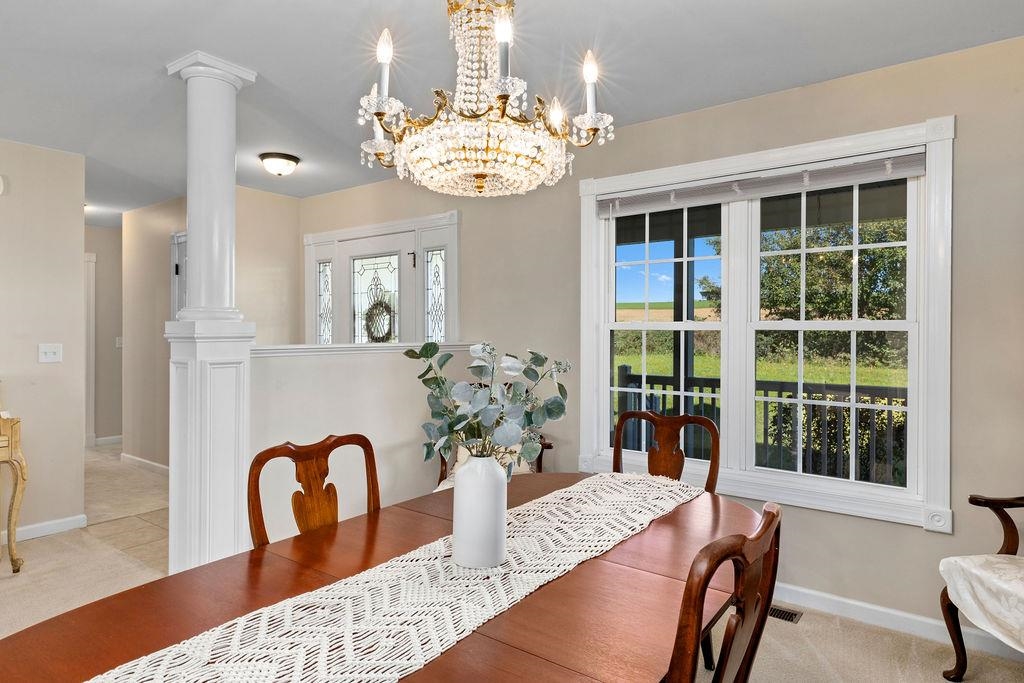 1401 Guthrie Road Stuarts Draft, VA 24477 - Photo 25 of 71 a view of a dining room with furniture window and wooden floor