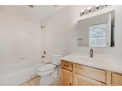 a bathroom with a sink a toilet and a bathtub