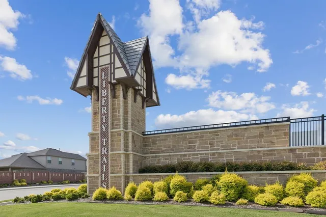 a front view of house with yard and trees