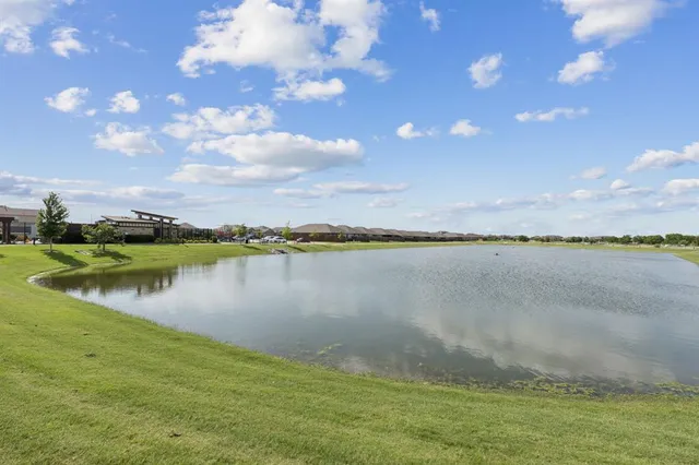 an aerial view of a house with pool table and chairs