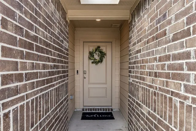 a view of a door and a window