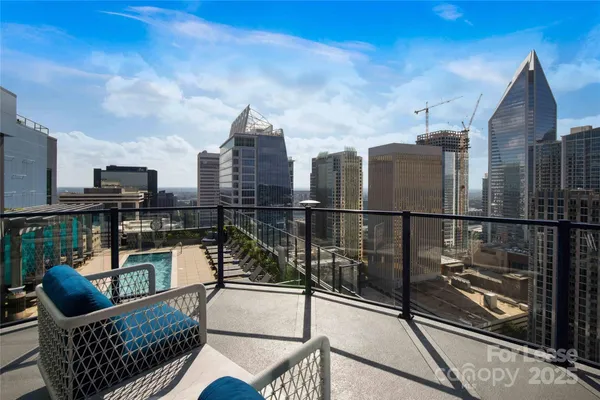 a view of roof deck with seating space and barbeque oven