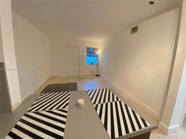 a kitchen with a cabinets and appliances