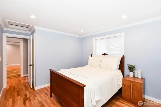 a spacious bedroom with a bed and a table