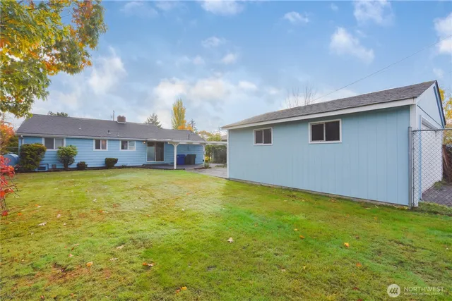 a front view of house with yard and swimming pool