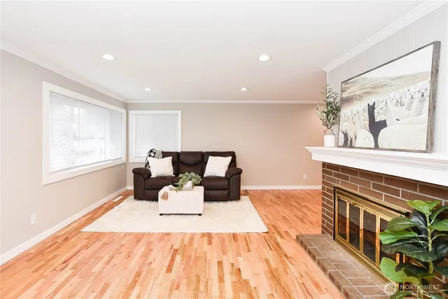 a bed room with a bed and a painting on the wall