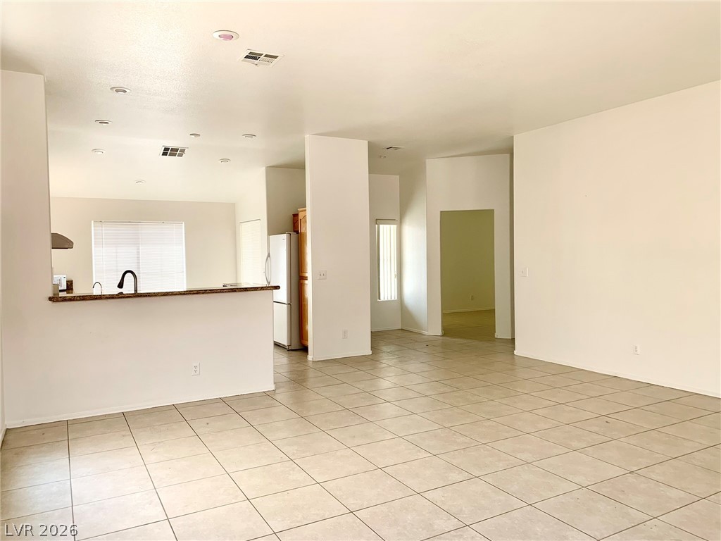 3821 Bombastic Court Las Vegas, NV 89147 - Photo 5 of 36 This bright and open space features seamless transitions and abundant natural light.