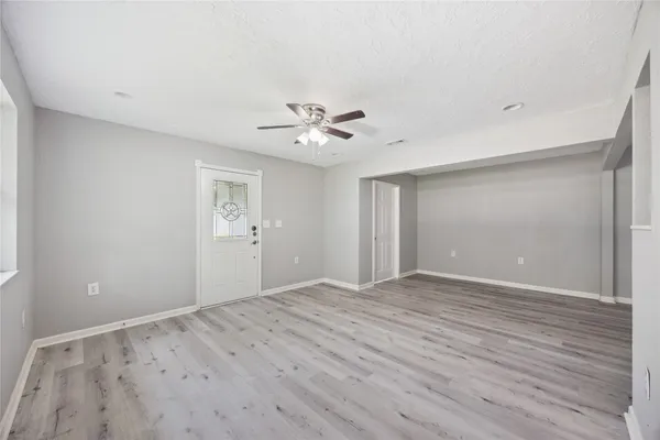a view of an empty room with a window