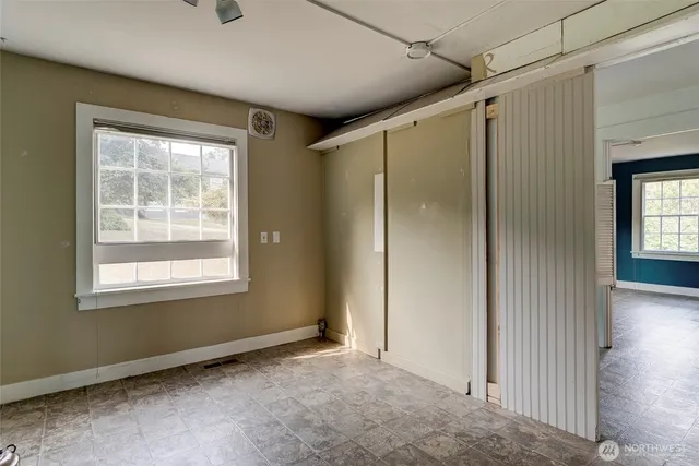 an empty room with windows