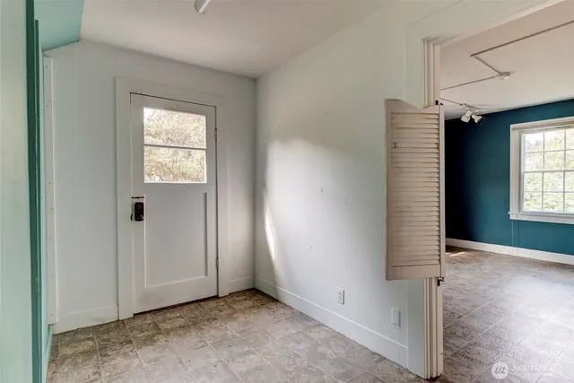 a view of an empty room with a window