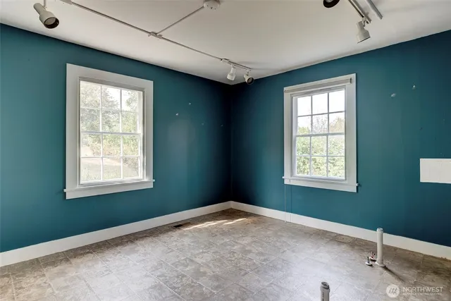 an empty room with windows