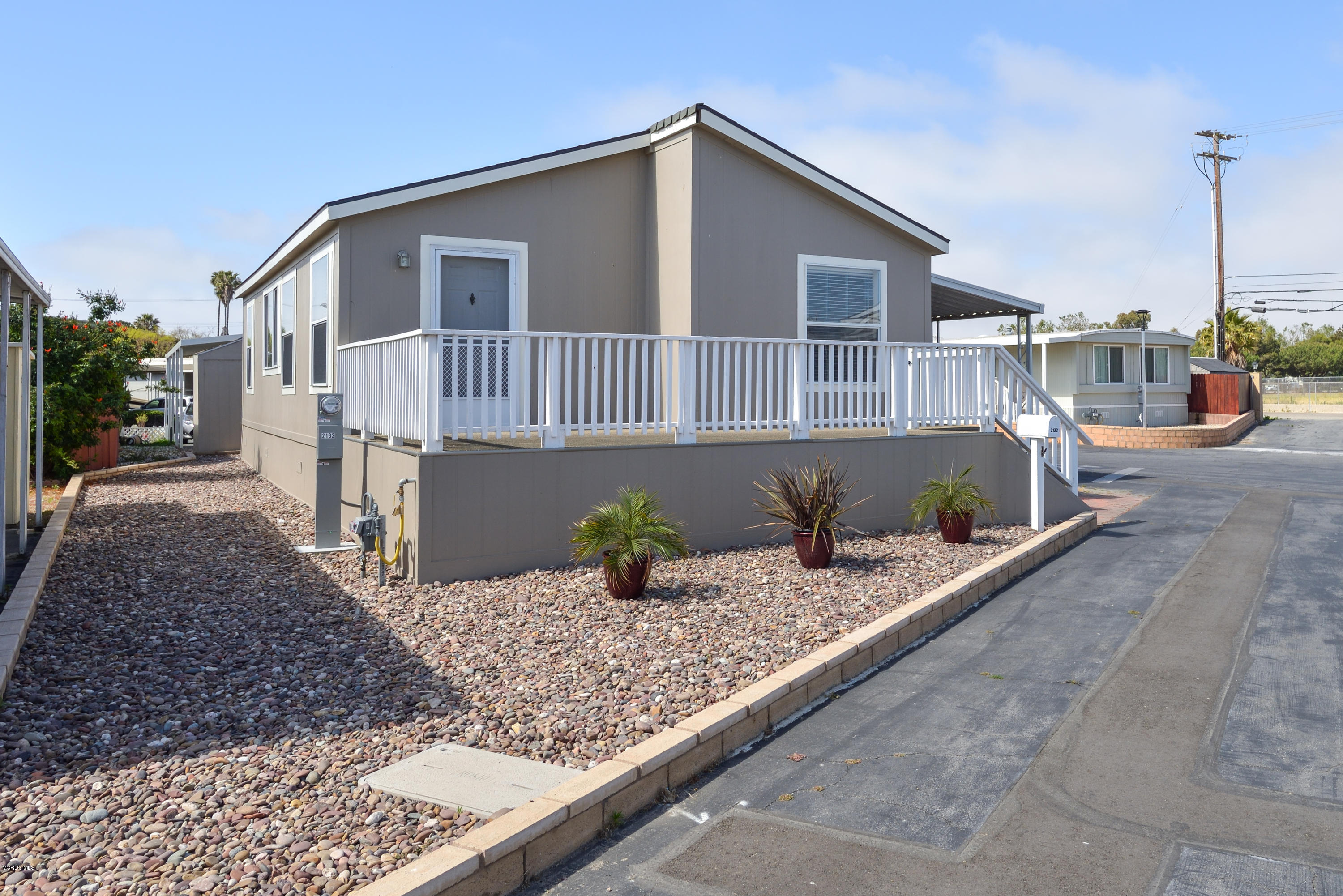 2132 Bluejay Avenue Oxnard, CA 93033 - Photo 2 of 20 a front view of a house with trees