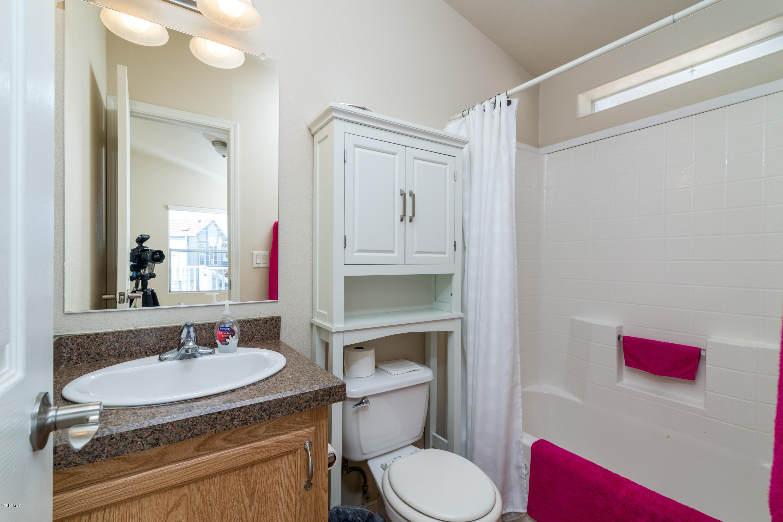 2132 Bluejay Avenue Oxnard, CA 93033 - Photo 13 of 20 a bathroom with a toilet a sink and a mirror