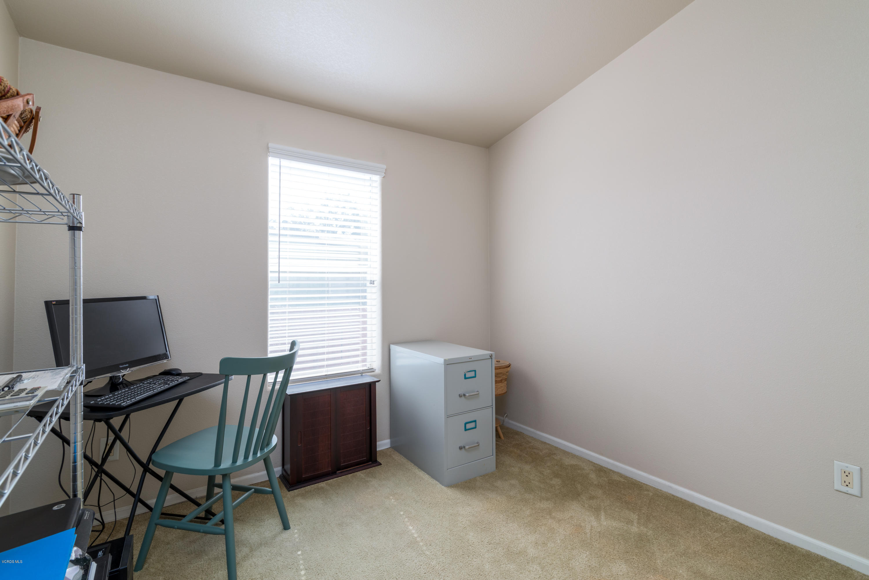 2132 Bluejay Avenue Oxnard, CA 93033 - Photo 16 of 20 a view of a workspace with furniture and a window