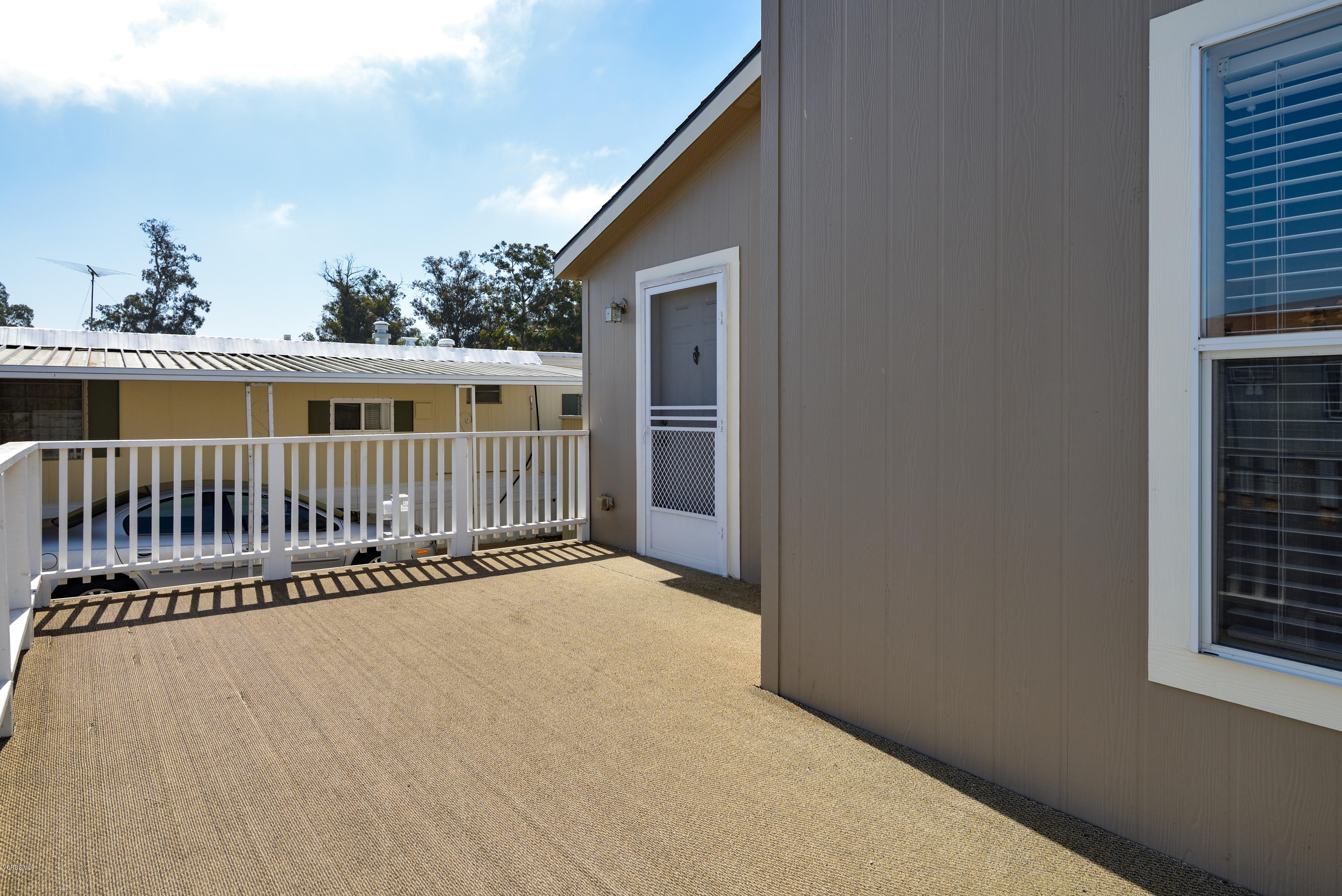 2132 Bluejay Avenue Oxnard, CA 93033 - Photo 4 of 20 a balcony with wooden floor and fence