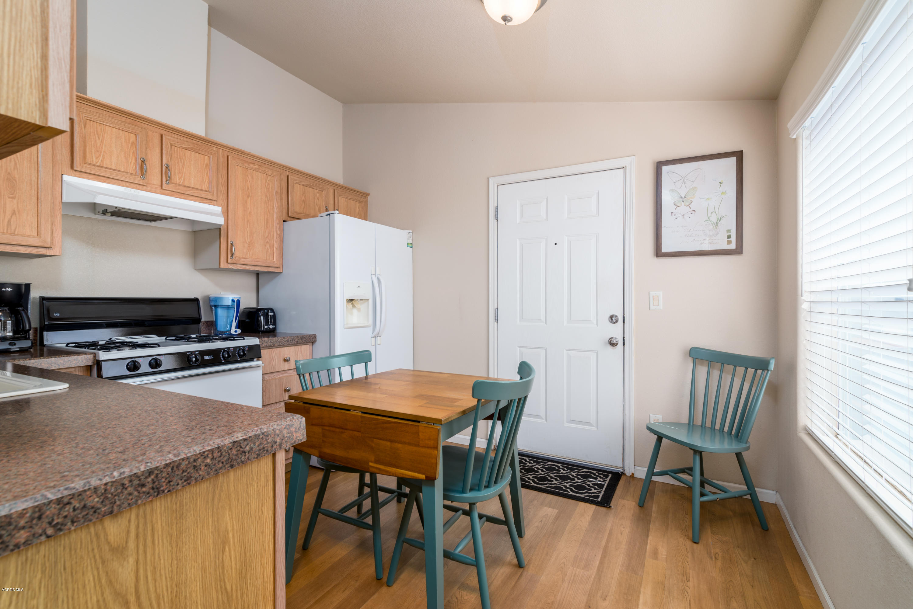 2132 Bluejay Avenue Oxnard, CA 93033 - Photo 7 of 20 a view of a dining room with furniture and wooden floor
