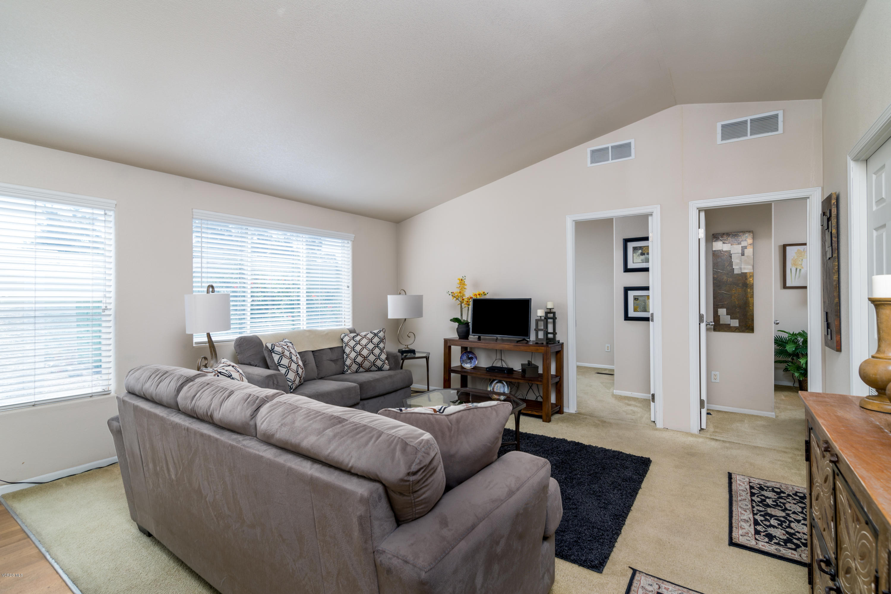 2132 Bluejay Avenue Oxnard, CA 93033 - Photo 9 of 20 a living room with furniture and a flat screen tv