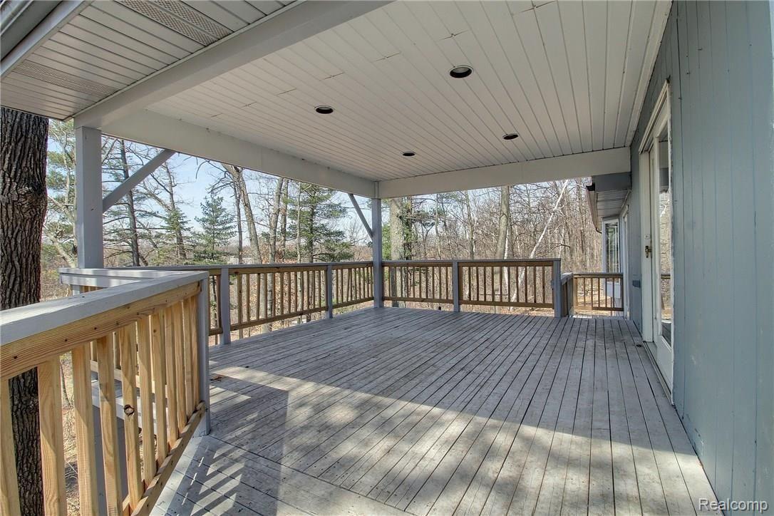 3139 Gilmour Road Leonard, MI 48367 - Photo 13 of 38 Upper_Covered_Deck_2nd_View.jpg