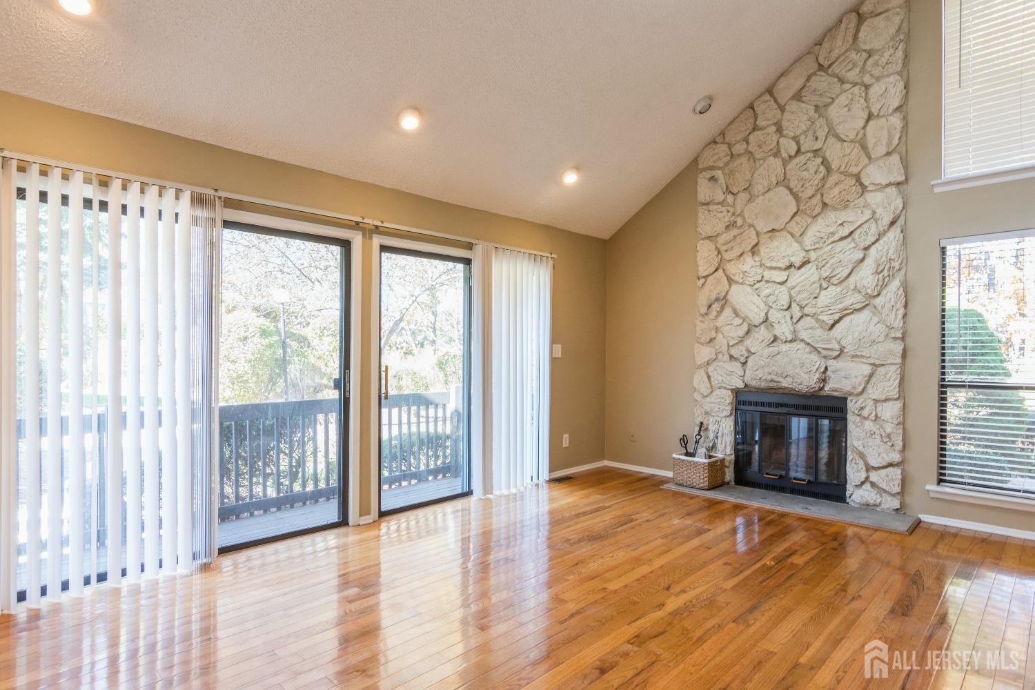 464 Westgate Drive Edison, NJ 08820 - Photo 6 of 31 a view of an empty room with wooden floor and a window