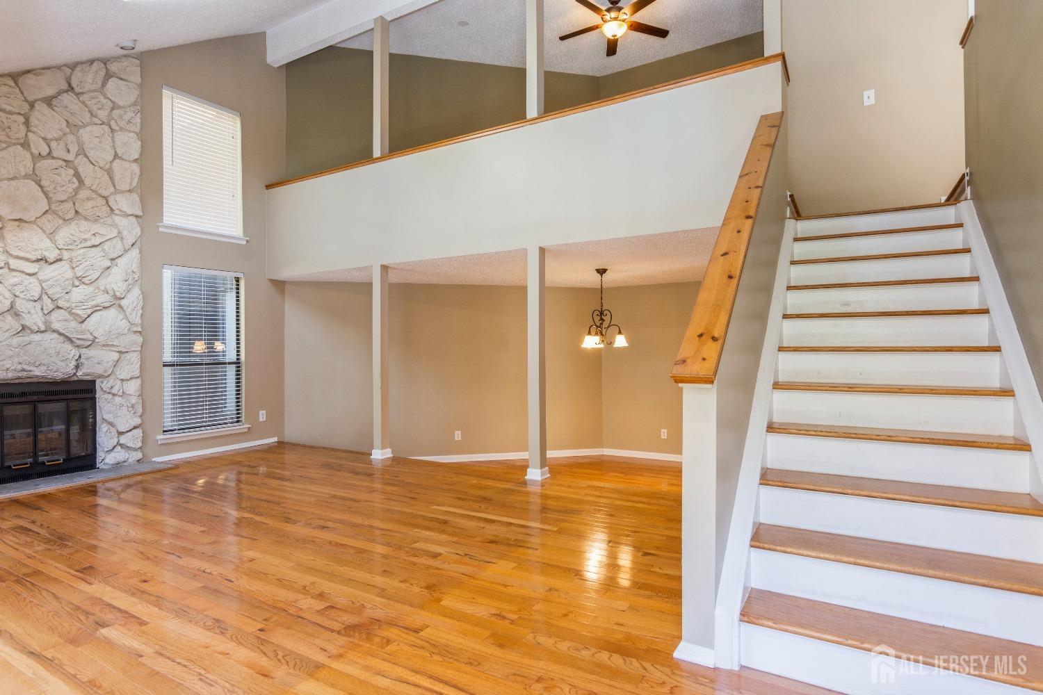 464 Westgate Drive Edison, NJ 08820 - Photo 9 of 31 a view of an entryway with wooden floor and a fireplace