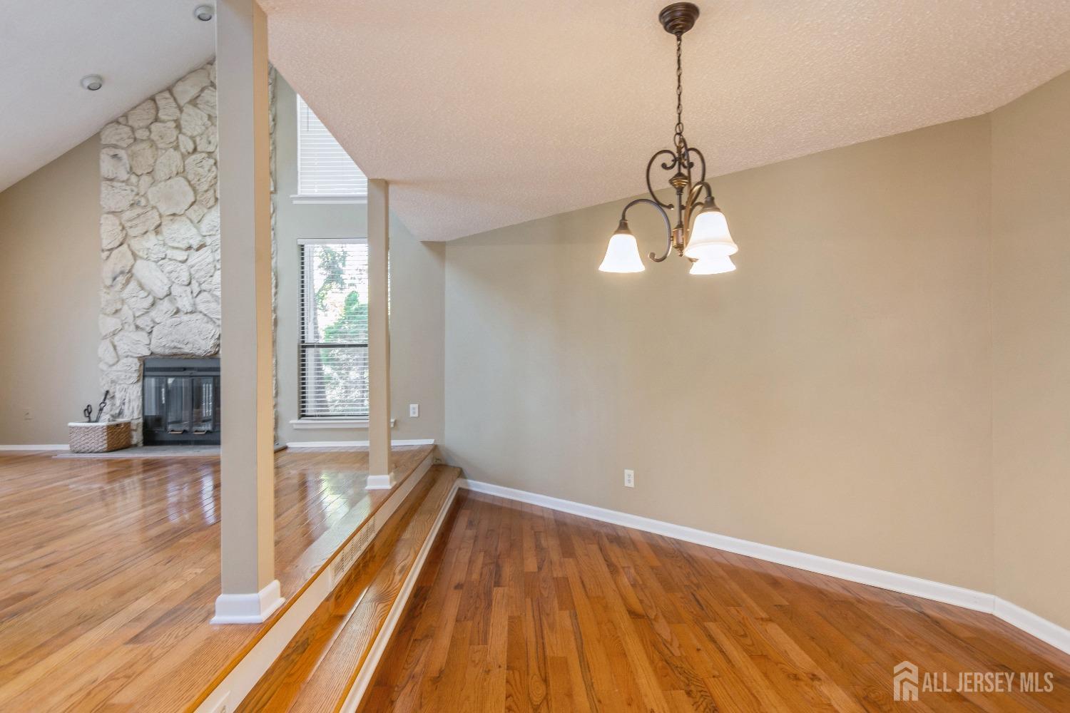 464 Westgate Drive Edison, NJ 08820 - Photo 10 of 31 a view of a room with wooden floor front door and windows