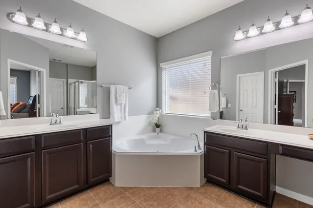 a bed room with a bed and a chandelier