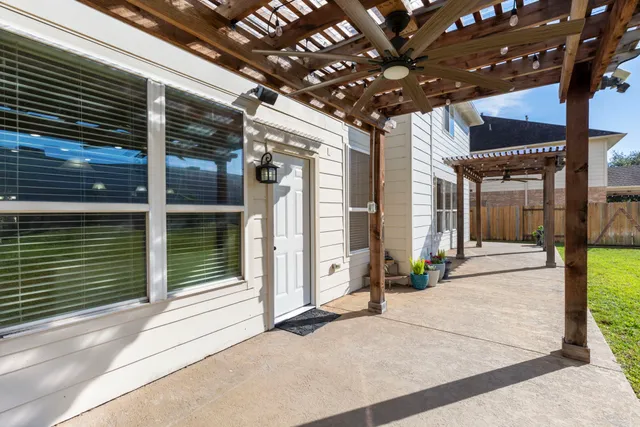 a bathroom with a bathtub sink and mirror