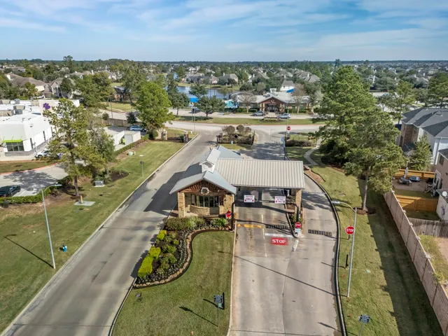 a view of a house with yard and sitting area