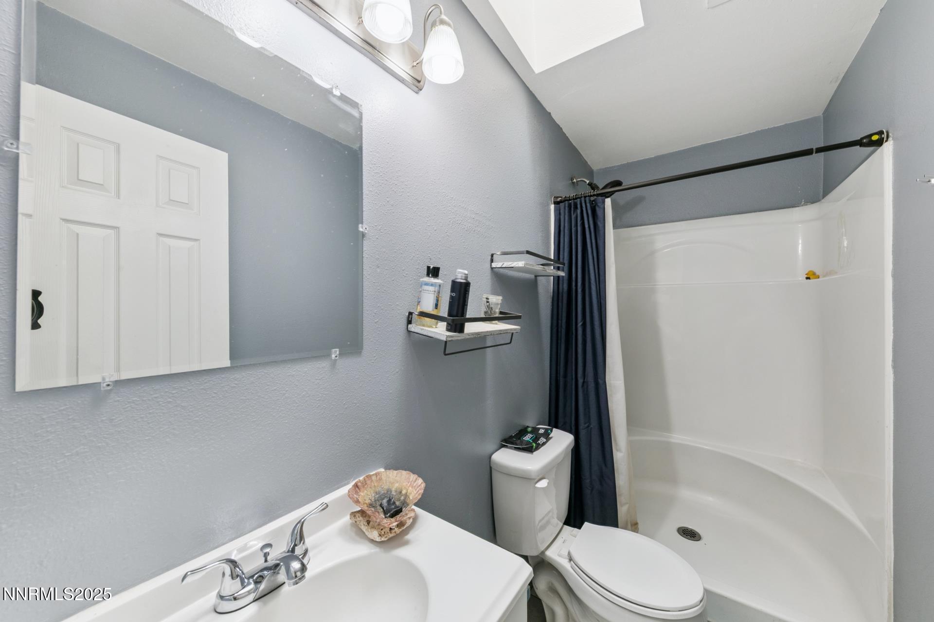 440 East 7th Street Reno, NV 89512 - Photo 11 of 14 a bathroom with a sink toilet and shower