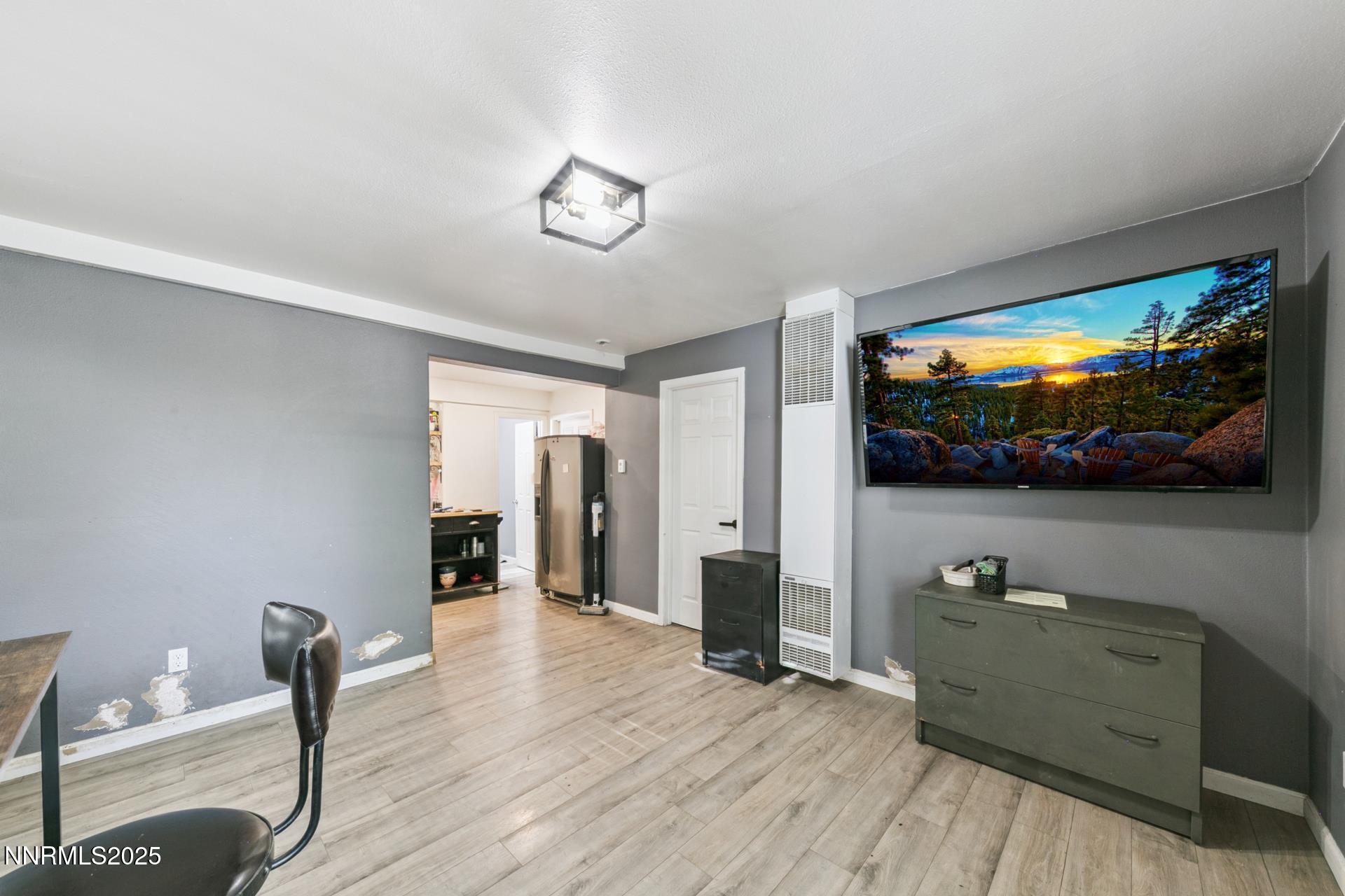 440 East 7th Street Reno, NV 89512 - Photo 3 of 14 a living room with furniture and a flat screen tv