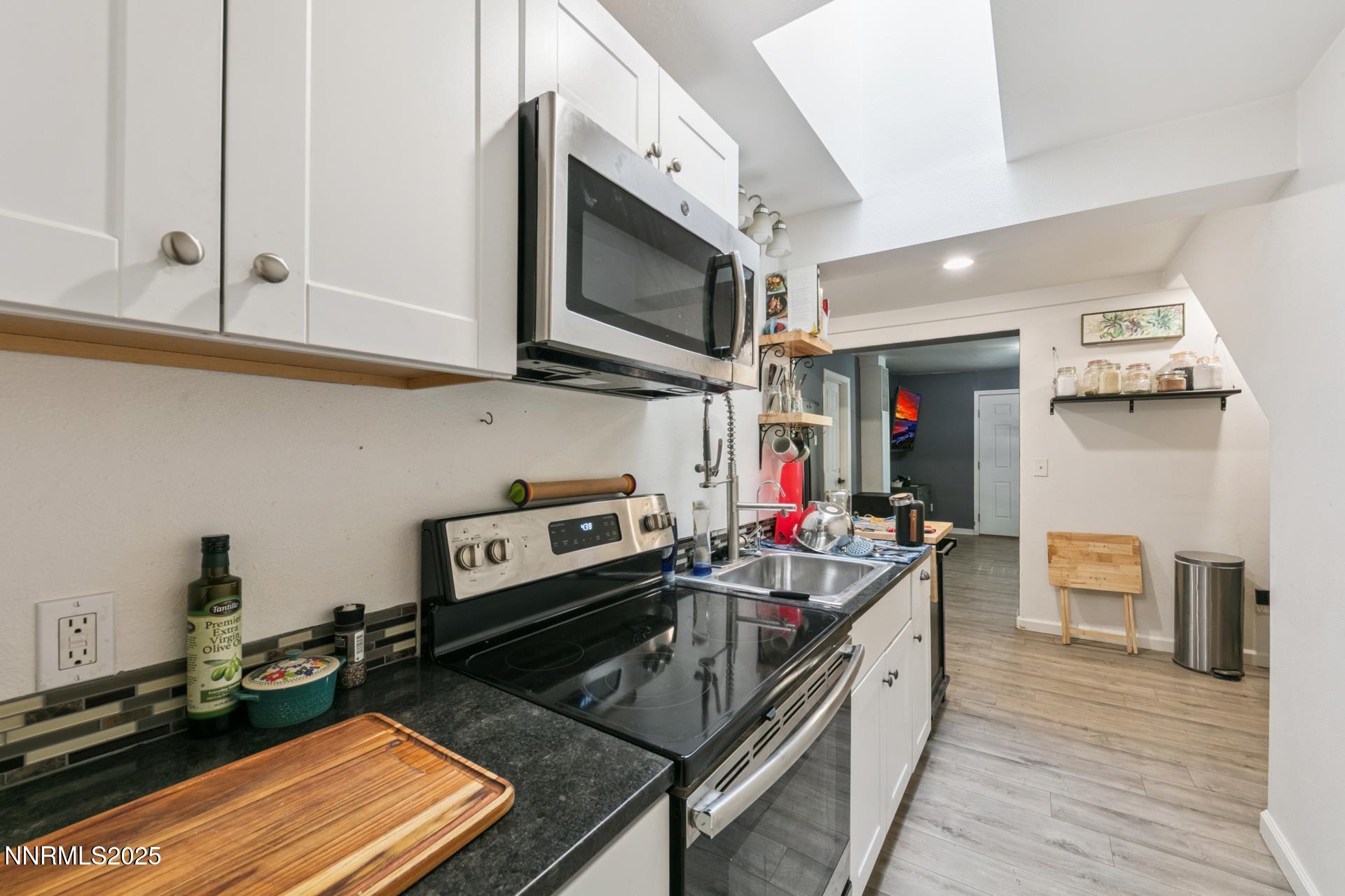 440 East 7th Street Reno, NV 89512 - Photo 8 of 14 a kitchen with a stove and a microwave