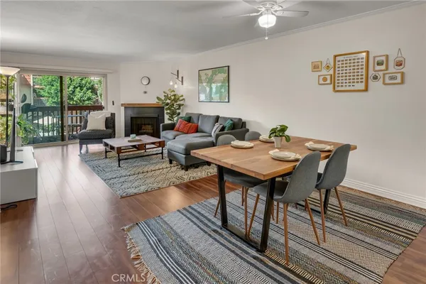 a living room with furniture a table and a fireplace